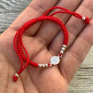 Sterling silver woven bracelet with St. Benedict medal for baby